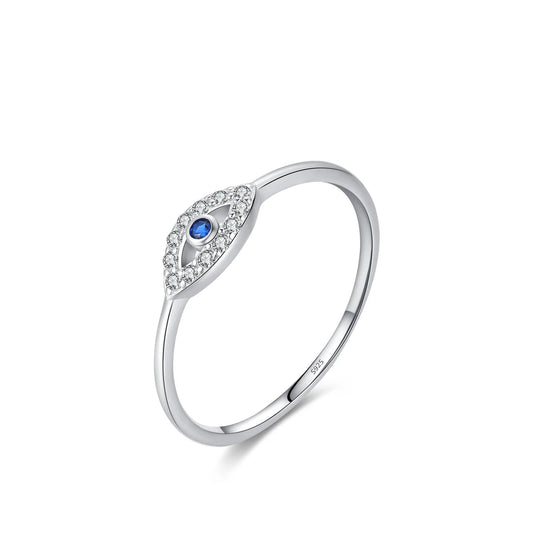 A silver-toned eye-shaped ring with a central blue gemstone and small clear stones, 