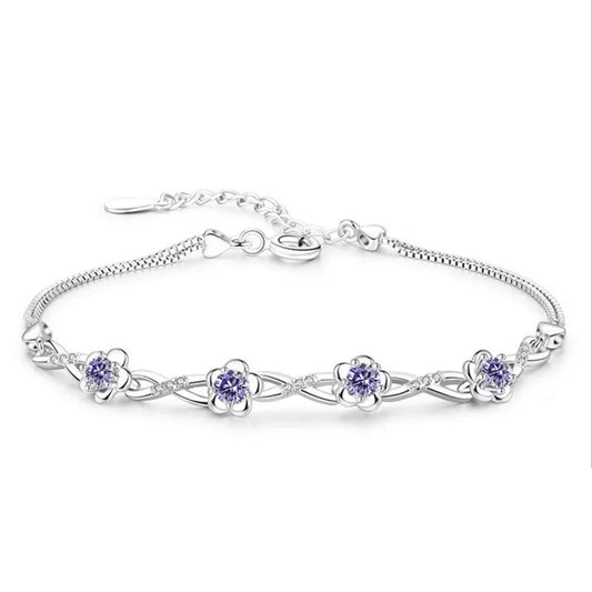Silver bracelet with floral designs